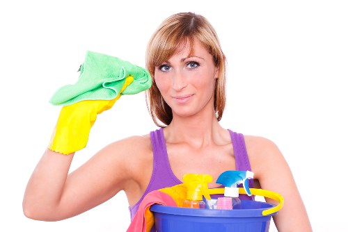 Cleaner working in a modern SE18 apartment living room